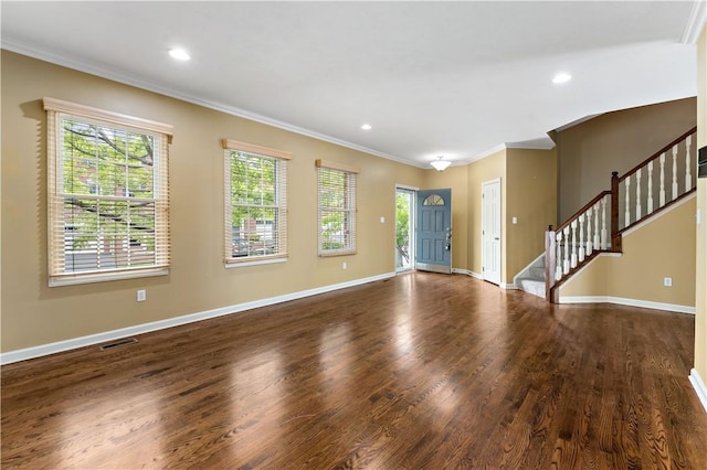 unfurnished living room with ornamental molding, dark wood-style floors, baseboards, stairway, and recessed lighting