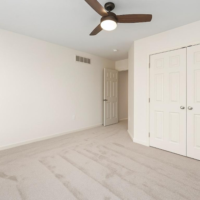 391 Marshall Heights Dr, Marshall, PA 15090 - unfurnished bedroom featuring light carpet, a closet, and a ceiling fan