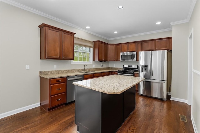 391 Marshall Heights Dr, Marshall, PA 15090 - kitchen with stainless steel appliances, dark wood finished floors, a center island, ornamental molding, and light stone countertops