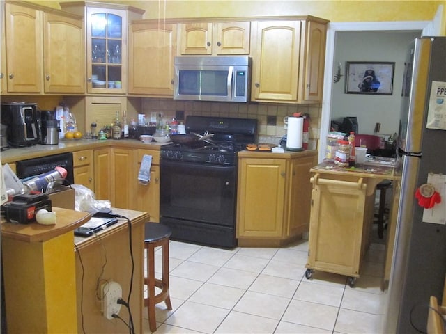 106 Conestoga Dr, Peters Twp, PA 15367 - kitchen featuring appliances with stainless steel finishes, light tile patterned floors, decorative backsplash, and glass insert cabinets