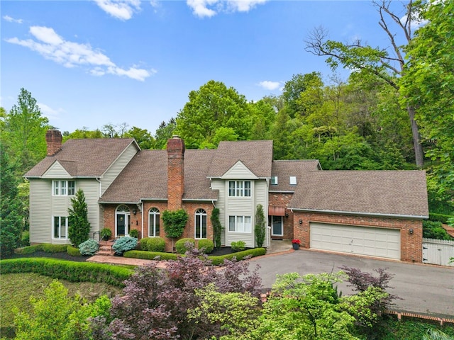 1 Way Hollow Rd, Edgeworth, PA 15143 - traditional home featuring brick siding, asphalt driveway, an attached garage, and roof with shingles