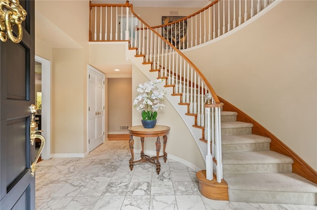 1 Way Hollow Rd, Edgeworth, PA 15143 - entryway with light marble finish flooring, stairway, baseboards, and a high ceiling