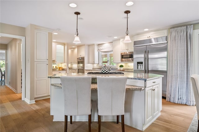 1 Way Hollow Rd, Edgeworth, PA 15143 - kitchen featuring built in appliances, a center island, light wood-style flooring, pendant lighting, and recessed lighting