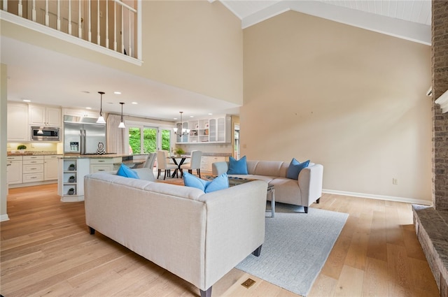 1 Way Hollow Rd, Edgeworth, PA 15143 - living room with light wood finished floors, high vaulted ceiling, and baseboards