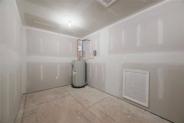 clothes washing area featuring electric water heater