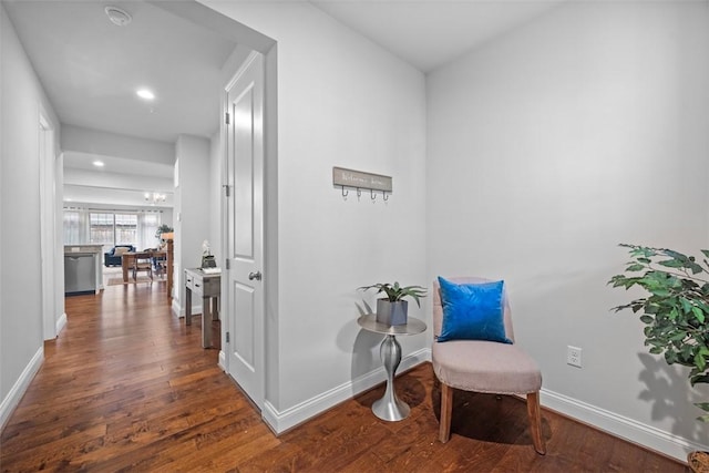 living area with wood finished floors, baseboards, and recessed lighting