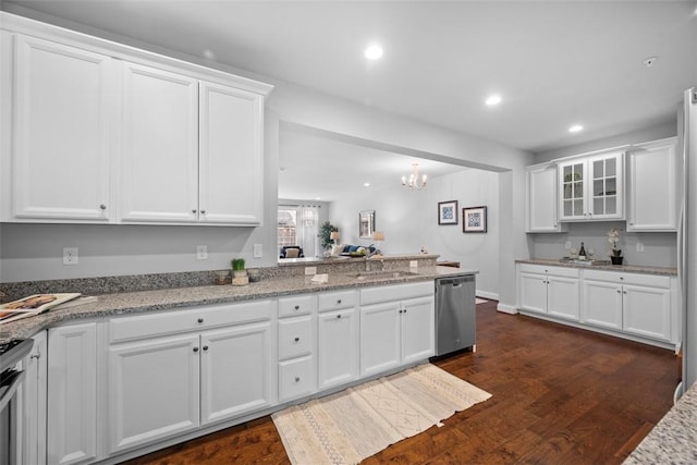 kitchen featuring dishwasher, white cabinetry, a sink, a chandelier, and recessed lighting