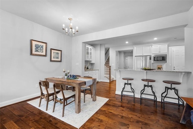 dining room with baseboards, recessed lighting, a chandelier, stairs, and dark wood finished floors