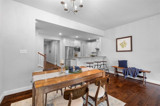 dining space with baseboards, stairs, dark wood-type flooring, a chandelier, and recessed lighting