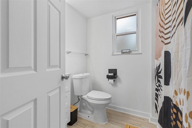 432 Iberia St, Mt Washington, PA 15211 - full bathroom featuring wood finished floors, baseboards, and toilet