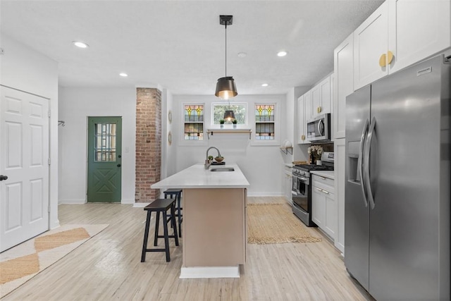 432 Iberia St, Mt Washington, PA 15211 - kitchen with stainless steel appliances, a sink, baseboards, light wood-type flooring, and light countertops