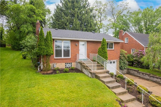 view of front of home with brick siding, a front yard, a chimney, a garage, and concrete driveway
