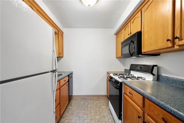 kitchen featuring black appliances, dark countertops, baseboards, and brown cabinetry