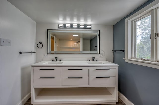 126 N Hitchman St, Mount Pleasant Boro, PA 15666 - full bathroom featuring baseboards and double vanity