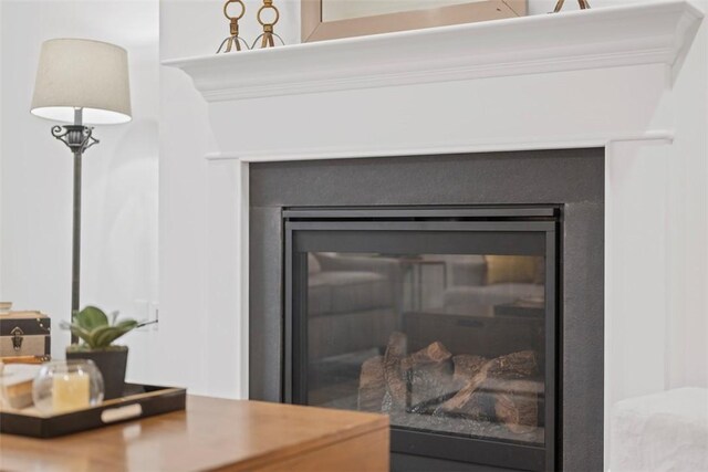 detailed view of a glass covered fireplace
