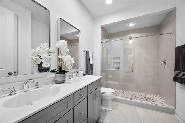 full bath with a stall shower, toilet, double vanity, recessed lighting, and tile patterned flooring