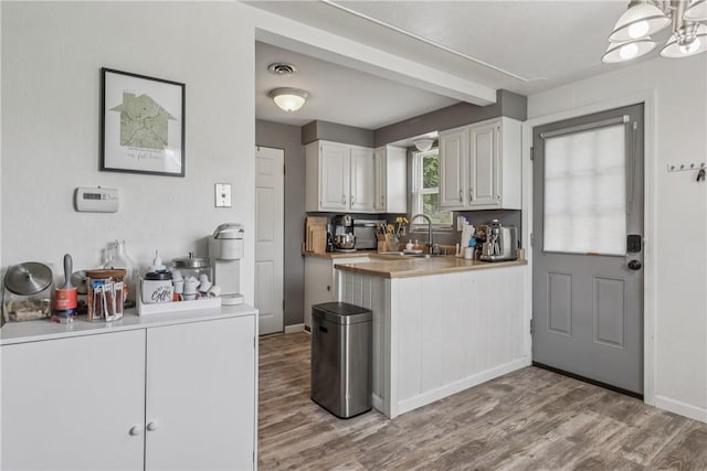 550 Mcclane Farm Rd, Chartiers, PA 15301 - kitchen with a sink, white cabinets, light wood-style floors, and light countertops