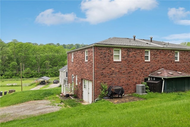 550 Mcclane Farm Rd, Chartiers, PA 15301 - back of house with central air condition unit, brick siding, and a yard