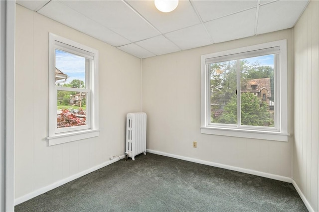 6640 Wilkins Ave, Squirrel Hill, PA 15217 - spare room with radiator heating unit, plenty of natural light, dark colored carpet, and a paneled ceiling