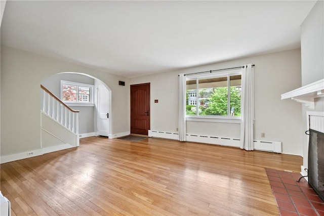 6640 Wilkins Ave, Squirrel Hill, PA 15217 - unfurnished living room featuring a fireplace, healthy amount of natural light, and light wood-type flooring