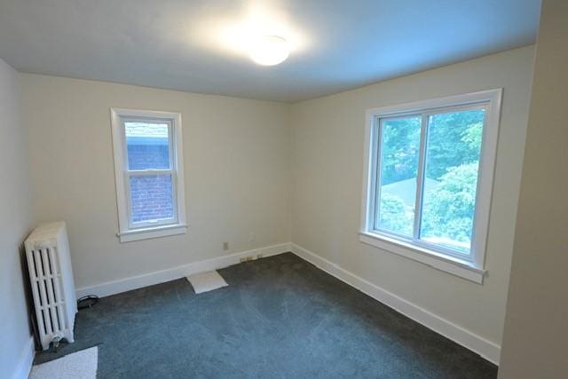 6640 Wilkins Ave, Squirrel Hill, PA 15217 - spare room with radiator, plenty of natural light, and dark carpet