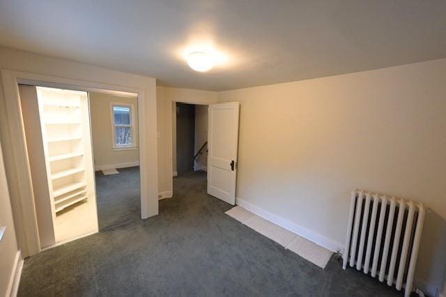 6640 Wilkins Ave, Squirrel Hill, PA 15217 - unfurnished bedroom featuring radiator heating unit and dark carpet