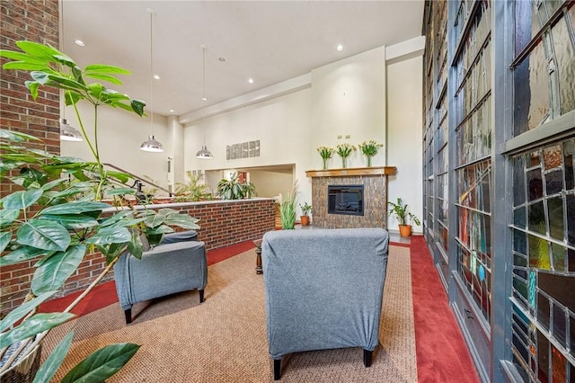 living room with carpet floors, a fireplace, and recessed lighting