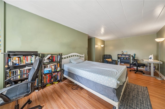 bedroom featuring wood finished floors
