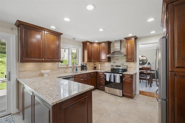 1805 Taper Dr, Upper St Clair, PA 15241 - kitchen with appliances with stainless steel finishes, wall chimney exhaust hood, a sink, a peninsula, and backsplash