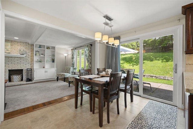 1805 Taper Dr, Upper St Clair, PA 15241 - dining space featuring a fireplace, beam ceiling, and a chandelier