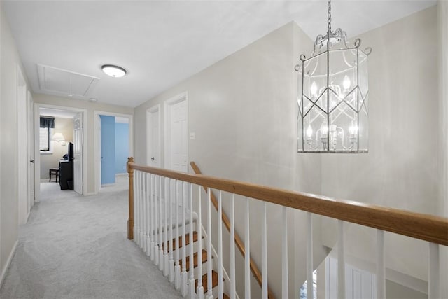 1805 Taper Dr, Upper St Clair, PA 15241 - corridor featuring attic access, light colored carpet, a chandelier, an upstairs landing, and baseboards