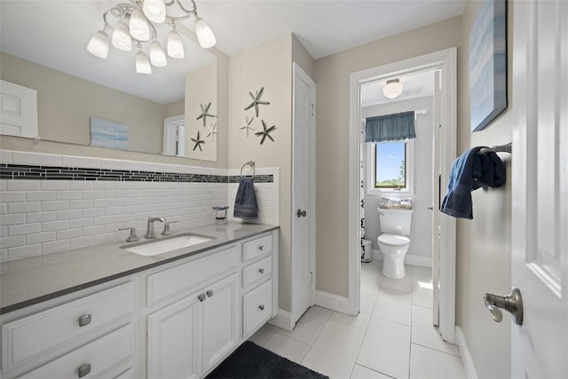 1805 Taper Dr, Upper St Clair, PA 15241 - bathroom with a chandelier, backsplash, tile patterned floors, baseboards, and toilet