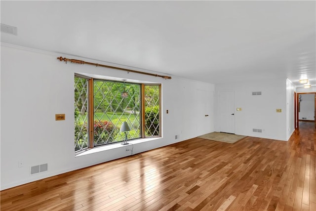 unfurnished living room with light wood-type flooring