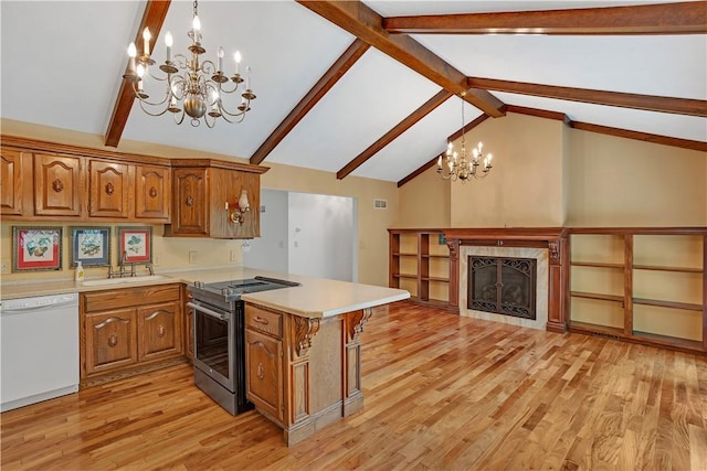 kitchen featuring dishwasher, stainless steel electric range oven, a chandelier, and brown cabinets