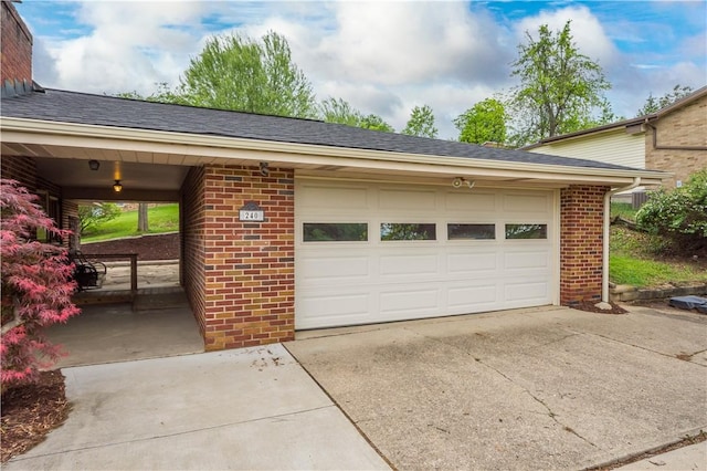 garage with concrete driveway