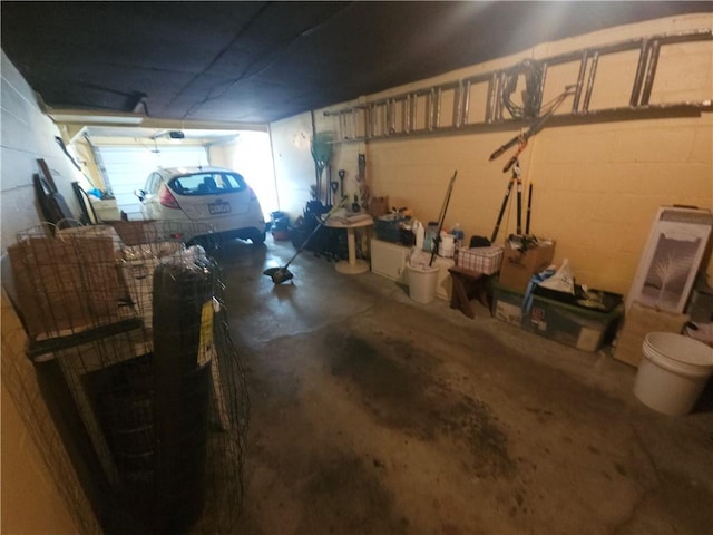 garage with concrete block wall