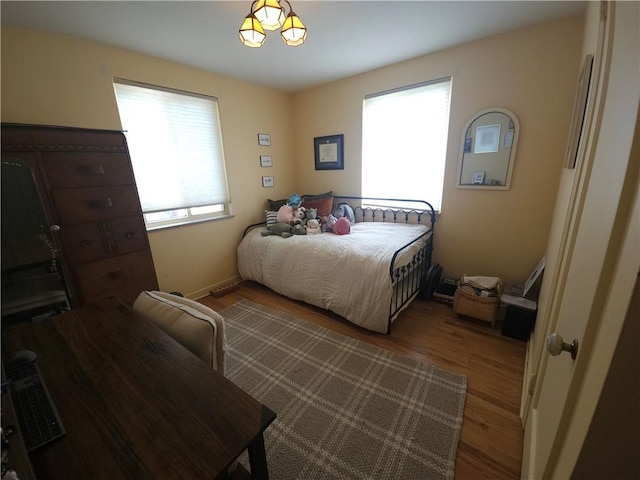 bedroom with wood finished floors