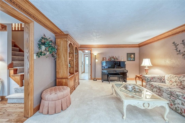 living area featuring stairway, ornamental molding, carpet, and baseboards