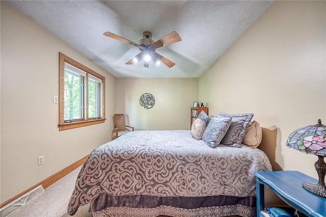 bedroom featuring carpet flooring, baseboards, and a ceiling fan