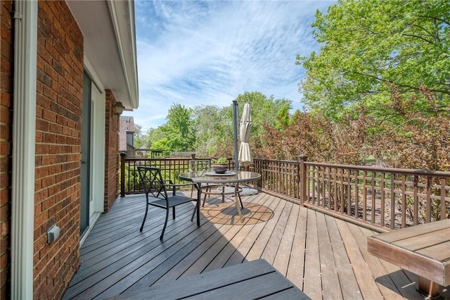 wooden deck with outdoor dining area