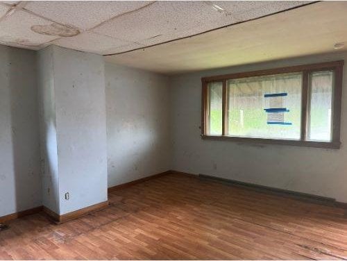 543 Highland Ave, Kittanning Boro, PA 16201 - empty room with wood finished floors and baseboards