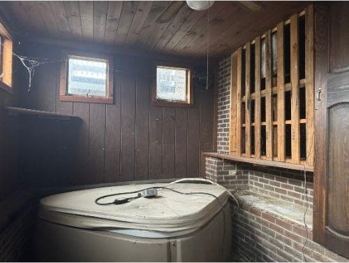 543 Highland Ave, Kittanning Boro, PA 16201 - interior space with wood ceiling, brick wall, and wood walls