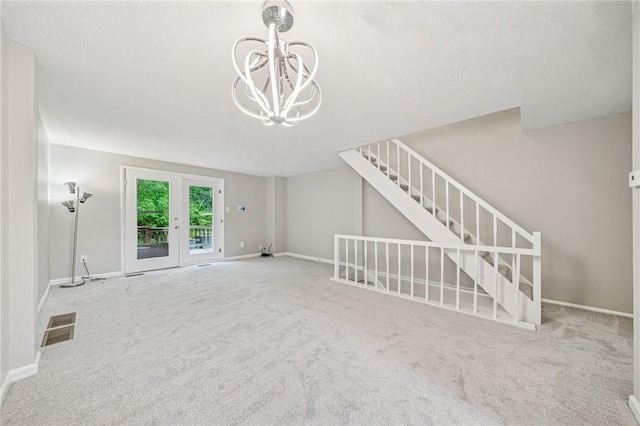 610 Arkwood Dr, Bethel Park, PA 15102 - unfurnished living room featuring carpet, french doors, a chandelier, and baseboards