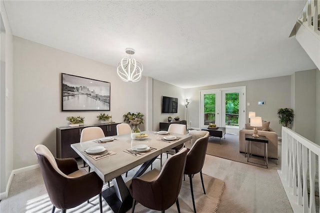610 Arkwood Dr, Bethel Park, PA 15102 - dining area with a chandelier, baseboards, and light carpet