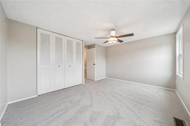 610 Arkwood Dr, Bethel Park, PA 15102 - unfurnished bedroom featuring a closet, carpet floors, baseboards, and a ceiling fan