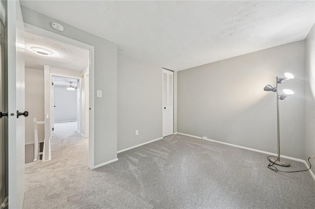 610 Arkwood Dr, Bethel Park, PA 15102 - unfurnished bedroom with carpet flooring, baseboards, a closet, and a textured ceiling