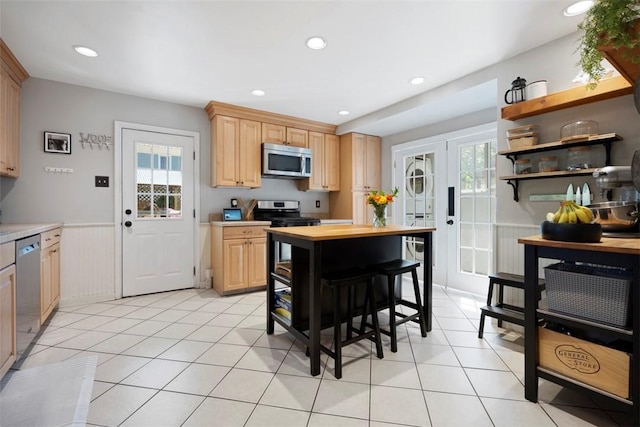 701 Thorn St, Sewickley, PA 15143 - kitchen featuring appliances with stainless steel finishes, wainscoting, light brown cabinetry, plenty of natural light, and recessed lighting