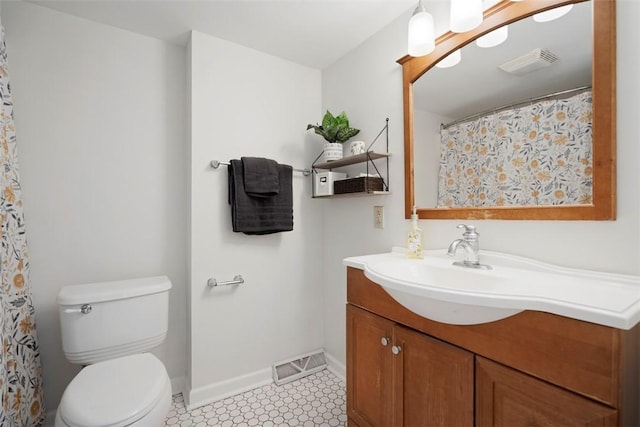 701 Thorn St, Sewickley, PA 15143 - bathroom featuring baseboards, toilet, vanity, and tile patterned floors
