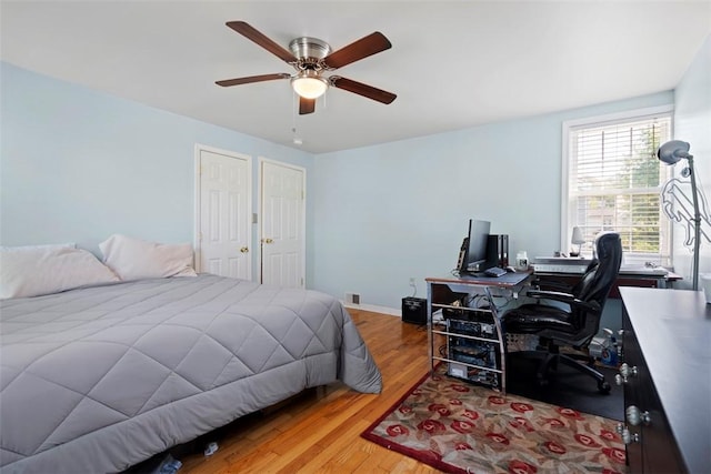 701 Thorn St, Sewickley, PA 15143 - bedroom with a desk, wood finished floors, baseboards, and a ceiling fan
