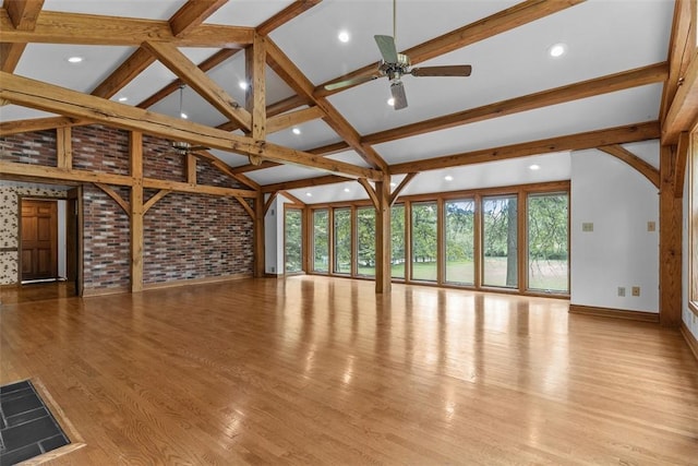 unfurnished living room with healthy amount of natural light, a ceiling fan, baseboards, wood finished floors, and recessed lighting
